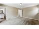 Bedroom featuring neutral carpeting, and view to bathroom at 8056 Meadowdale Sq, Niwot, CO 80503