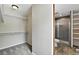 Walk in closet leading to renovated bathroom with shower at 8056 Meadowdale Sq, Niwot, CO 80503