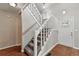 Inviting entryway with staircase, laminate flooring, and a door with decorative window at 8056 Meadowdale Sq, Niwot, CO 80503
