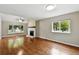 Spacious living room with fireplace and large window with neighborhood view at 8056 Meadowdale Sq, Niwot, CO 80503