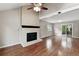 Bright living room featuring a fireplace and hardwood floors, perfect for gatherings at 8056 Meadowdale Sq, Niwot, CO 80503