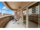 Exterior view of a balcony with furniture and stone railings, offering a pleasant outdoor space and city views at 1950 N Logan St # 601, Denver, CO 80203