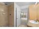 Modern bathroom features a tiled shower, and a view of the outside balcony at 1950 N Logan St # 601, Denver, CO 80203