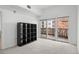 Bright bedroom with a private balcony overlooking the city at 1950 N Logan St # 601, Denver, CO 80203