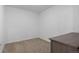 Neutral bedroom features beige carpet, white walls, and natural light at 1950 N Logan St # 601, Denver, CO 80203
