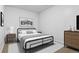 Cozy bedroom features neutral decor, large picture window, and side tables at 1950 N Logan St # 601, Denver, CO 80203
