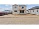 Home's backyard featuring a concrete patio and newly installed lawn at 9652 Cathay St, Commerce City, CO 80022