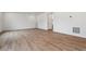 Spacious basement area with light hardwood flooring and white walls ready for customization at 9652 Cathay St, Commerce City, CO 80022