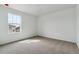 Bright, carpeted bedroom with window providing natural light into the space at 9652 Cathay St, Commerce City, CO 80022