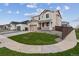 Charming home with a well-kept lawn and sidewalk. The side of the house is lined with decorative rock and a dark wood fence at 9652 Cathay St, Commerce City, CO 80022