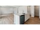 Modern kitchen with a quartz countertop island and stainless steel appliances at 9652 Cathay St, Commerce City, CO 80022