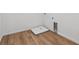 Empty laundry room with hardwood floors and hookups ready for a washer and dryer at 9652 Cathay St, Commerce City, CO 80022
