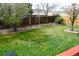 Spacious fenced-in backyard with a lush lawn at 4303 S Yank St, Morrison, CO 80465