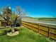 Fenced backyard offering views of the sky and nearby land, creating a serene outdoor space at 4303 S Yank St, Morrison, CO 80465