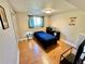 Bedroom features wood flooring, overhead lighting, and closet space at 4303 S Yank St, Morrison, CO 80465