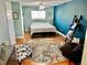 Comfortable bedroom with a stylish rug and well-lit space, perfect for relaxation and rest at 4303 S Yank St, Morrison, CO 80465