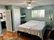 Cozy bedroom with a ceiling fan, window, and hardwood flooring, offering a peaceful retreat at 4303 S Yank St, Morrison, CO 80465