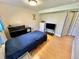 Bedroom with wood flooring, a comfortable bed, dresser, and ample closet space at 4303 S Yank St, Morrison, CO 80465