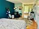 Bright bedroom with ample space, cozy seating, and a comfortable bed for relaxing at 4303 S Yank St, Morrison, CO 80465