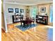 Elegant dining room with hardwood floors, a table set, and natural light from the windows at 4303 S Yank St, Morrison, CO 80465