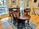 Elegant dining room with hardwood floors, a table set, and natural light from the windows at 4303 S Yank St, Morrison, CO 80465
