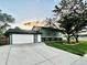 Charming two-story home with a well-maintained lawn and a two car garage at 4303 S Yank St, Morrison, CO 80465
