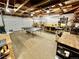 An oversized garage is set up as a workshop with a ping pong table and storage at 4303 S Yank St, Morrison, CO 80465