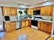 Spacious kitchen with oak cabinets, modern appliances, and bright lighting at 4303 S Yank St, Morrison, CO 80465