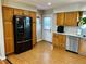 Spacious kitchen with oak cabinets, modern appliances, and bright lighting at 4303 S Yank St, Morrison, CO 80465