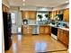 Spacious kitchen with oak cabinets, modern appliances, and bright lighting at 4303 S Yank St, Morrison, CO 80465