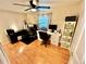 Home office features wood floor, ceiling fan, and dual work stations with great lighting at 4303 S Yank St, Morrison, CO 80465