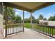 Inviting back porch with views of the landscaped backyard and a clear blue sky at 5193 Rustic Ave, Firestone, CO 80504