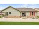 Lush backyard with a spacious concrete patio and sliding glass doors for seamless indoor-outdoor living at 5193 Rustic Ave, Firestone, CO 80504