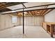 Unfinished basement area featuring sturdy support beams and a concrete foundation at 5193 Rustic Ave, Firestone, CO 80504