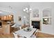 Bright dining area featuring a modern chandelier and an open layout to the kitchen at 5193 Rustic Ave, Firestone, CO 80504