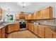 Bright kitchen featuring wood cabinets, countertops, stainless steel appliances, and hardwood floors at 5193 Rustic Ave, Firestone, CO 80504