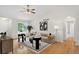 Bright living room with a modern design, hardwood floors, and a ceiling fan at 5193 Rustic Ave, Firestone, CO 80504
