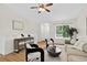Comfortable living room with hardwood floors, plenty of natural light, and modern decor at 5193 Rustic Ave, Firestone, CO 80504
