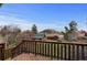 Enjoy the lush backyard view from the deck with mature trees and mountain backdrop at 25 High St, Palmer Lake, CO 80133