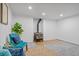 Finished basement with a wood burning stove, light gray carpet, and recessed lighting at 25 High St, Palmer Lake, CO 80133