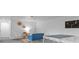 Finished basement featuring a ping pong table, ' play area, and woven wall decor at 25 High St, Palmer Lake, CO 80133