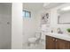 Updated bathroom with a modern vanity, a tiled shower, and stylish decor at 25 High St, Palmer Lake, CO 80133