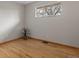 Bright bedroom featuring hardwood floors, ample natural light from the windows, and neutral wall colors at 25 High St, Palmer Lake, CO 80133