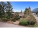 Brick home with mature trees and landscaping at 25 High St, Palmer Lake, CO 80133