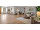 Open-concept space featuring hardwood floors, a comfortable seating area, and an adjacent dining space at 25 High St, Palmer Lake, CO 80133