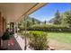 Inviting porch with a cozy seating area offering serene views of the landscape at 25 High St, Palmer Lake, CO 80133