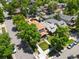An aerial view of the property showcasing its mature landscaping, including trees and a well-manicured lawn at 400 S Gilpin St, Denver, CO 80209