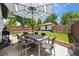 Beautiful backyard featuring a dining set, patio, manicured lawn, and privacy fence at 400 S Gilpin St, Denver, CO 80209