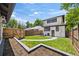Backyard with a manicured lawn, privacy fence, patio, and outdoor dining set at 400 S Gilpin St, Denver, CO 80209