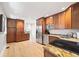 Spacious kitchen features granite countertops, stainless steel appliances, and wood cabinetry at 400 S Gilpin St, Denver, CO 80209